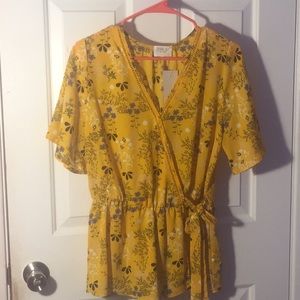 Yellow blouse with purple flowers